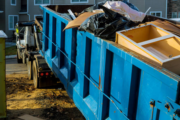 Dumpster, recycle waste and garbage bins near new construction of appartment houses building